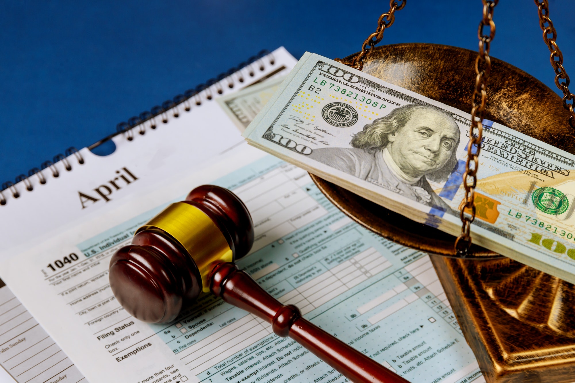 law-concept-scales-of-justice-criminal-liability-for-non-payment-of-taxes-of-one-hundred-dollars.jpg